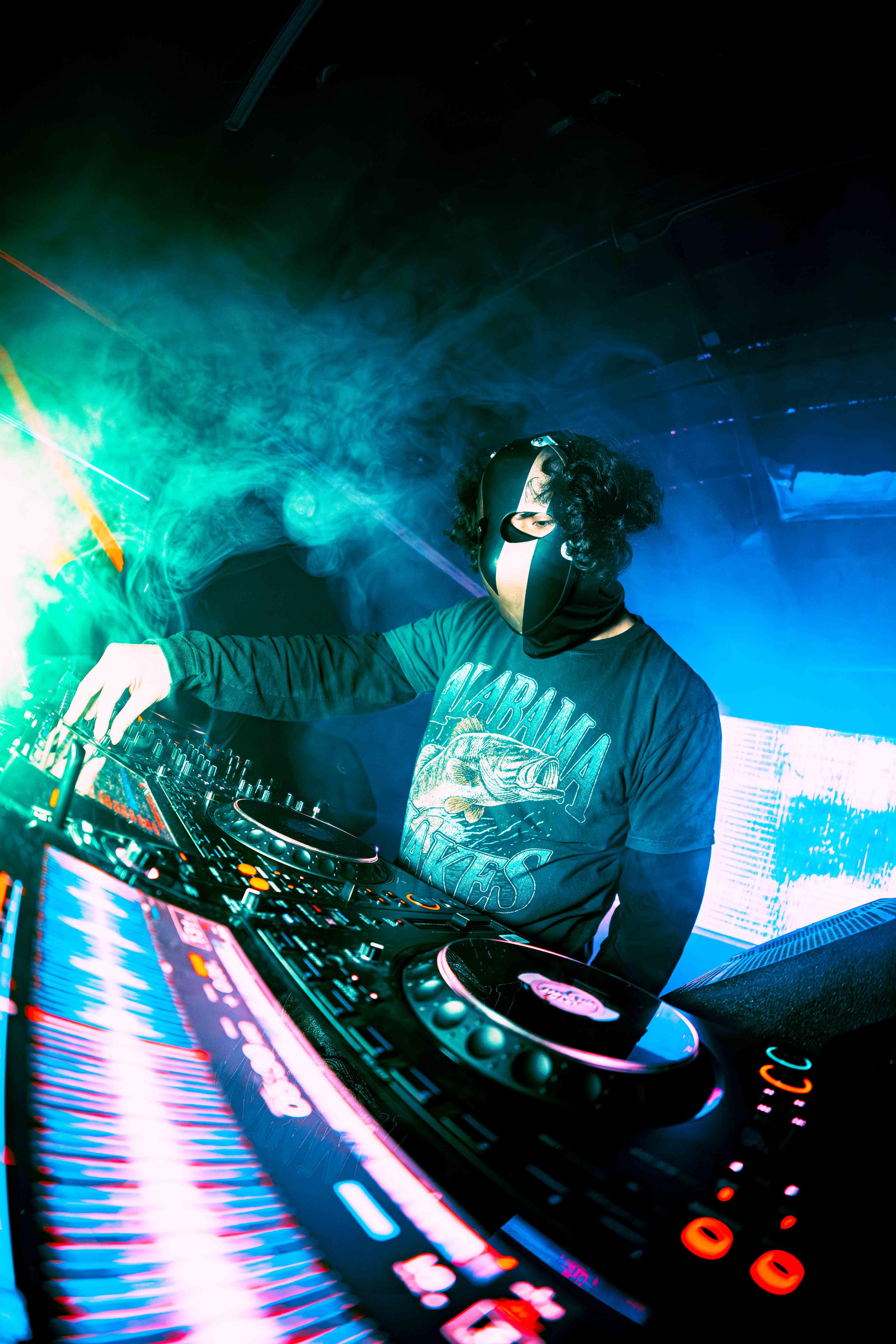 Wide angle shot of stadium concert with pyrotechnics exploding above the stage