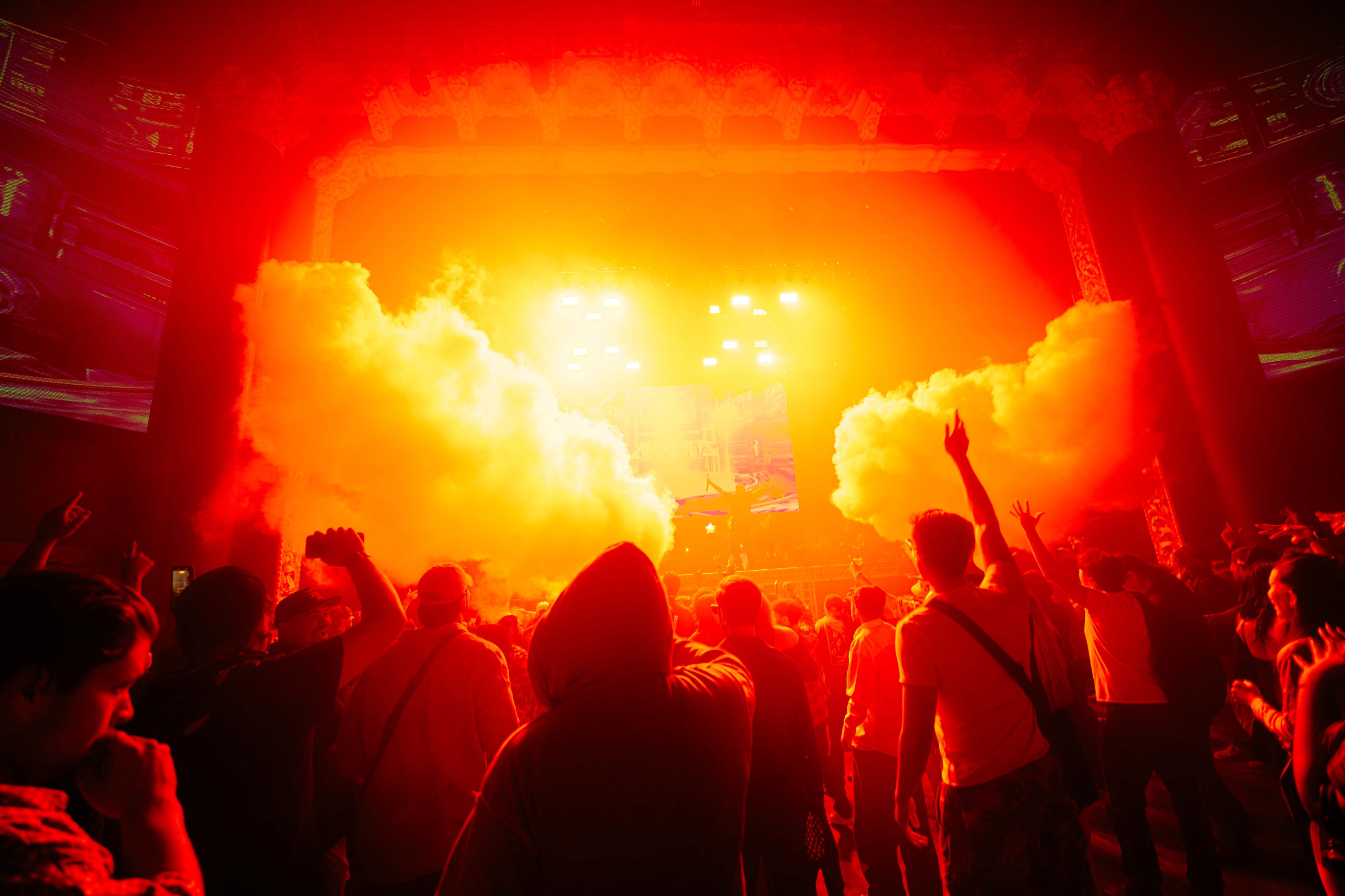 Performer on stage captured in a dynamic live concert moment